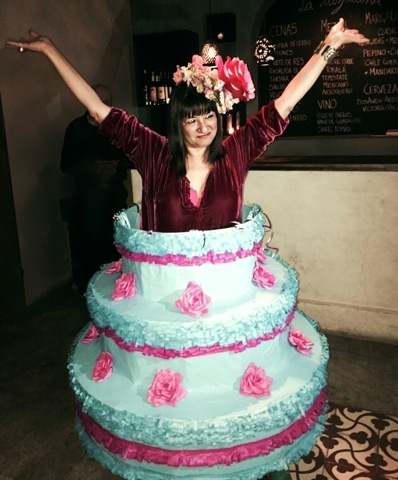 Sandra Cisneros as her own birthday cake. Piñata skirt by Eva and Jorge Rios, photo by Tracy Boyer