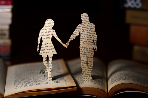 paper cutout of a couple on a book