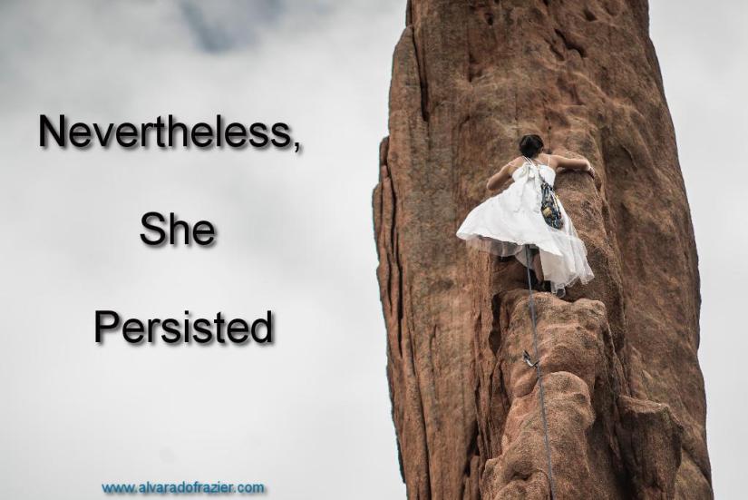Woman in a dress climbing rock