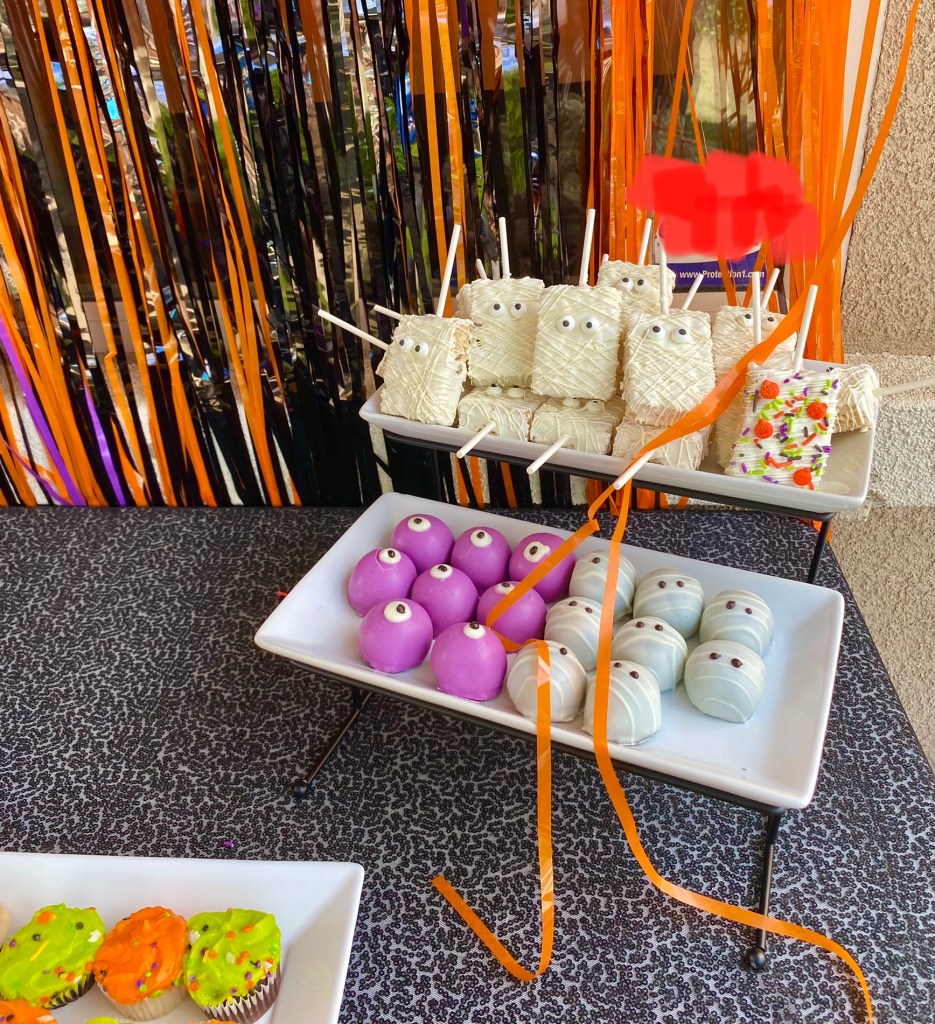 purple and orange decorated chocolate balls and ghost treats for Halloween